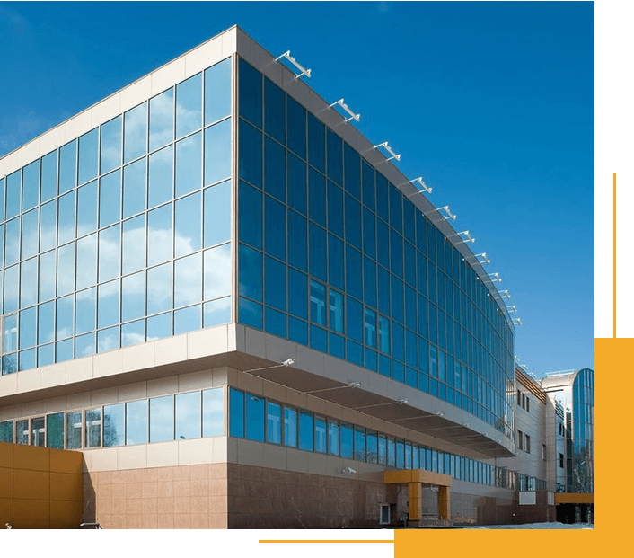 A Large Building With Many Windows and a Sky Background