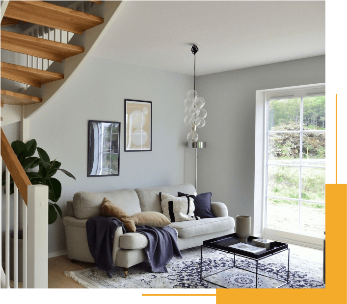 A Living Room Filled With Furniture and a Stair Case