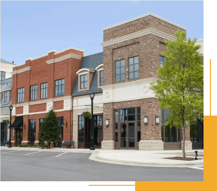 A Large Brick Building Sitting on the Corner of a Street